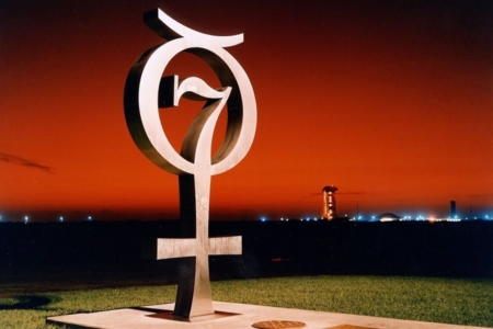 <p><strong>Figure 1.3</strong> In 1964, the logo for Project Mercury was created as a metal commemorative monument, standing near Launch Complex 14 at Cape Canaveral. Source: NASA</p>