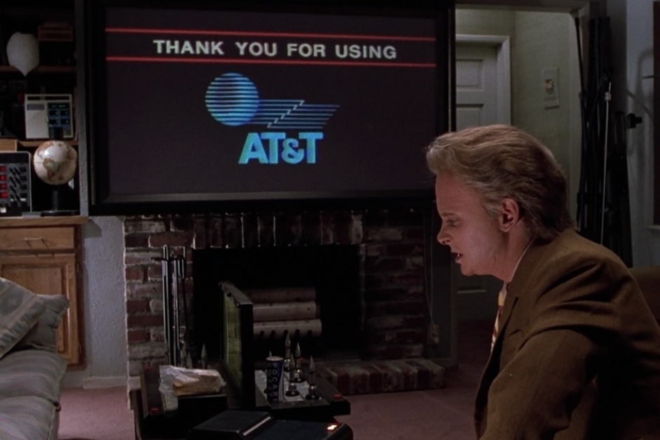 <p><strong>Figure 1.5</strong> As 2015 Marty concludes his video call with Needles, we see the AT&T logo briefly on screen. Note that the ampersand has changed.</p>