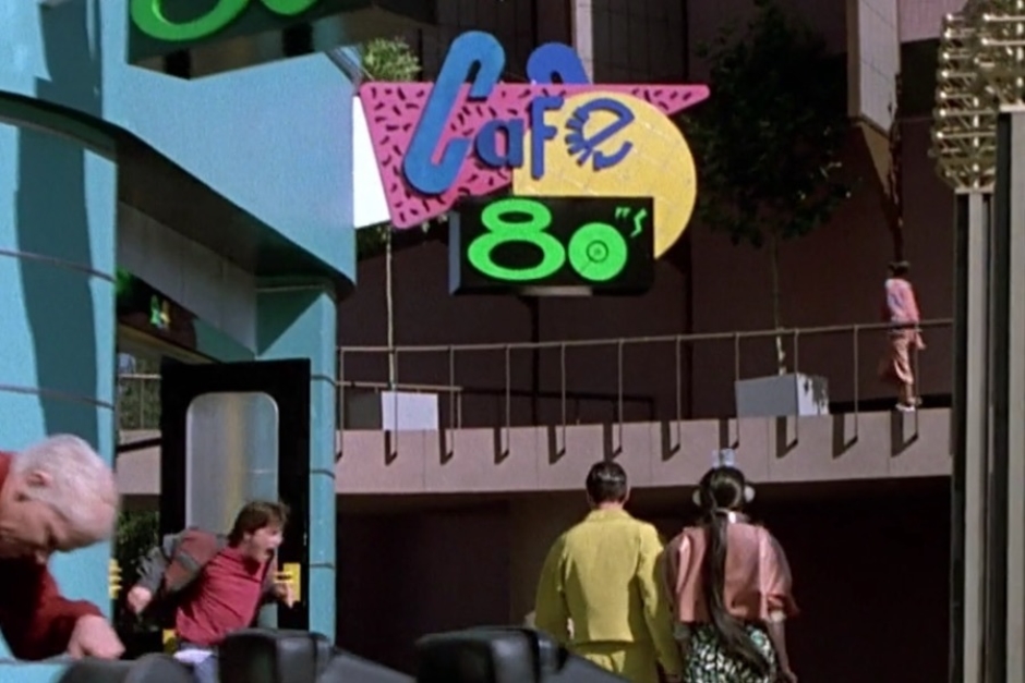 <p><strong>Figure 1.6</strong> As Marty flees from Cafe 80s, we get another look at the logo on exterior signage. I notice the colors used for the characters in “CaFe” change a little from one instance to another. </p>