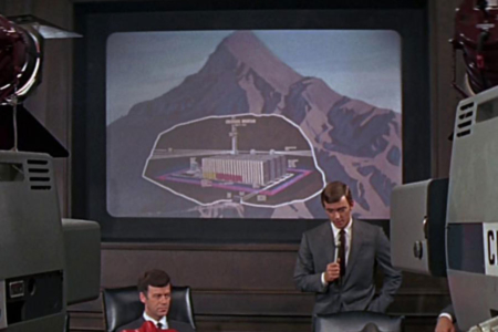 <p><strong>Figure 3.2</strong> At the press conference that follows the activation of Colossus, Forbin explains where the computer system resides deep within a mountain.</p>