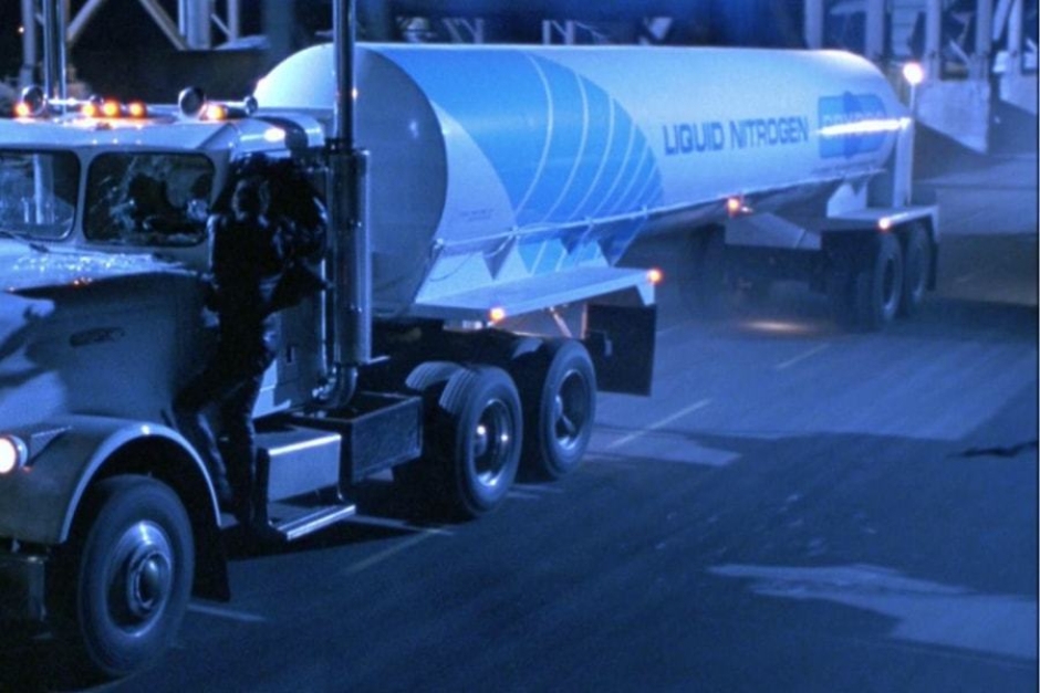<p><strong>Figure 2.3</strong> The forward end of the tanker trailer is wrapped by a large blue stripe, that is broken into gradated lines.</p>