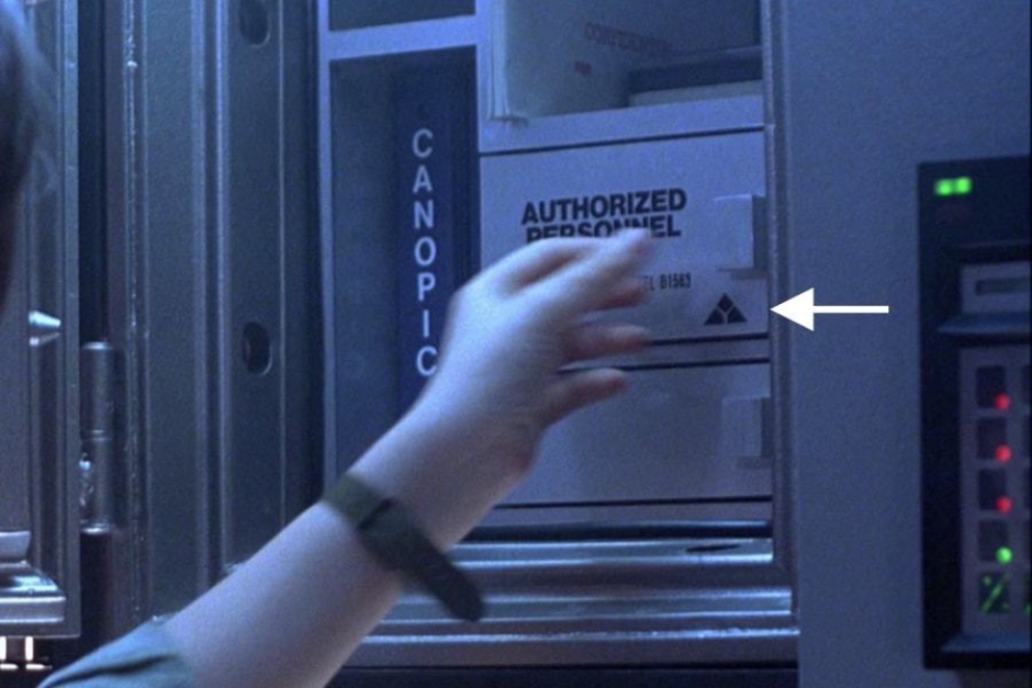 <p><strong>Figure 5.4</strong> A 1-color instance of the mark can be seen on the key safe for the vault, as John Connor opens it.</p>