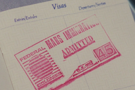 <p><strong>Figure 3.3</strong> Visa stamp, with what appears to be a mistakenly used version of the Federal Colonies logo without its two moons.</p>