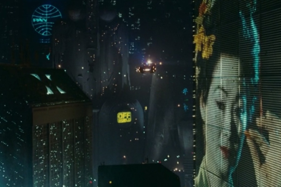 <p><strong>Figure 3.1</strong> Early in the film, we see the Off-world logo on illuminated building signage, that flashes from bright yellow to light blue.</p>