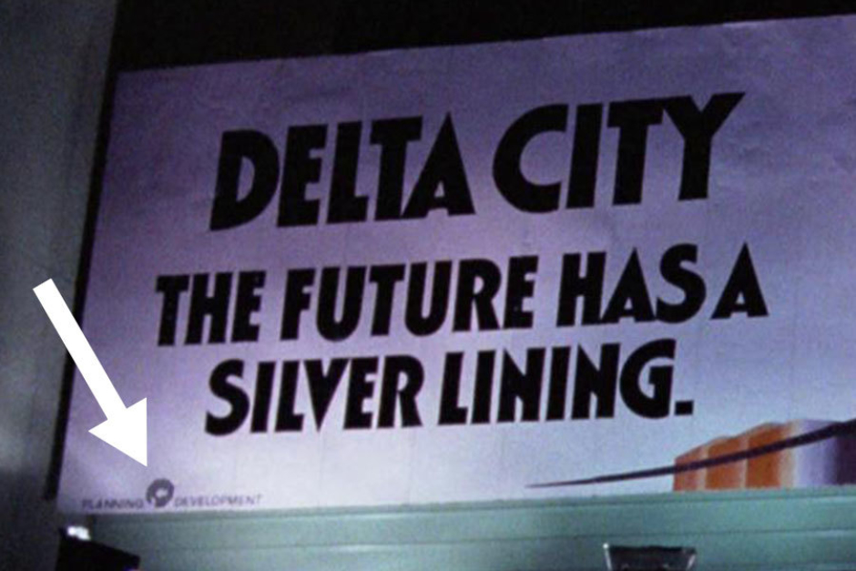 <p><strong>Figure 3.10</strong> In the scene where two thugs are attacking a woman, we see a billboard for OCP’s proposed Delta City. In the lower left corner, the OCP logo is locked up between the words “PLANNING” and “DEVELOPMENT.”</p>