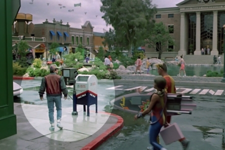 <p><strong>Figure 1.1</strong> As Marty takes in the future Hill Valley town square, he walks past a public mailbox offering PAC FAX service.</p>