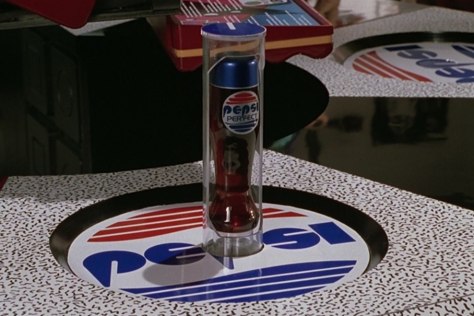 <p><strong>Figure 2.2</strong> When Marty orders a Pepsi, a bottle of Pepsi Perfect is dispensed via a tube that spirals up from below the P in the Pepsi logo.</p>