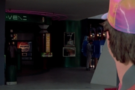<p><strong>Figure 1.1</strong> As Marty takes in the future Hill Valley town square, the Pepsi logo of the future is first spotted on a vending machine (center-left).</p>
