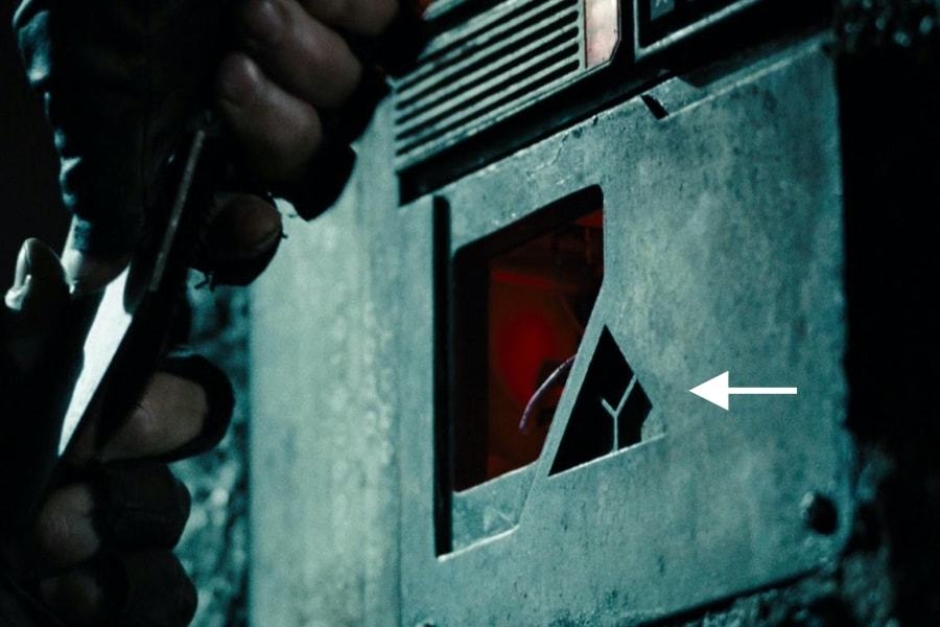 <p><strong>Figure 4.3</strong> Later, when John Connor infiltrates Skynet Central, we get an even closer look at the cast metal Skynet mark. Source: <em>Terminator: Salvation</em></p>