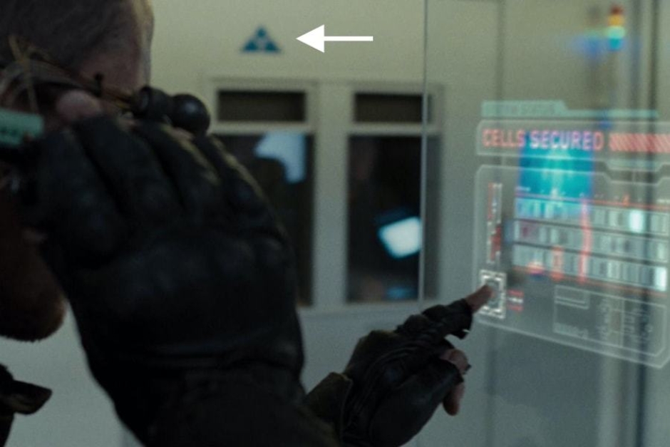 <p><strong>Figure 4.7</strong> As John Connor searches for Kyle Reese, we see instances of the Skynet mark in blue, on the top of cell doors. Source: <em>Terminator: Salvation</em></p>