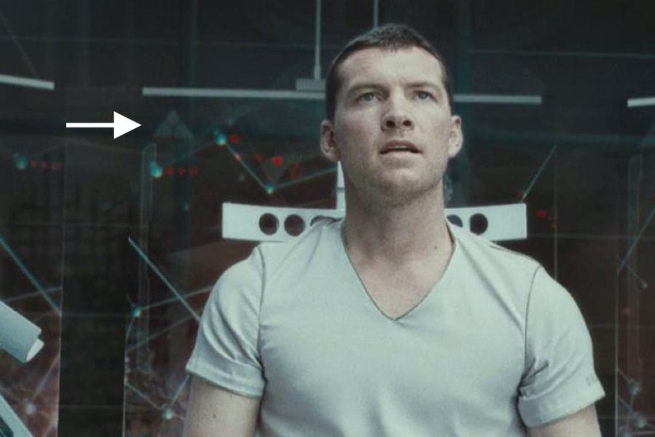 <p><strong>Figure 5.4</strong> White instances of the mark also appear on display screens in the background, as Marcus converses with Skynet's mainframe. Source: <em>Terminator: Salvation</em></p>