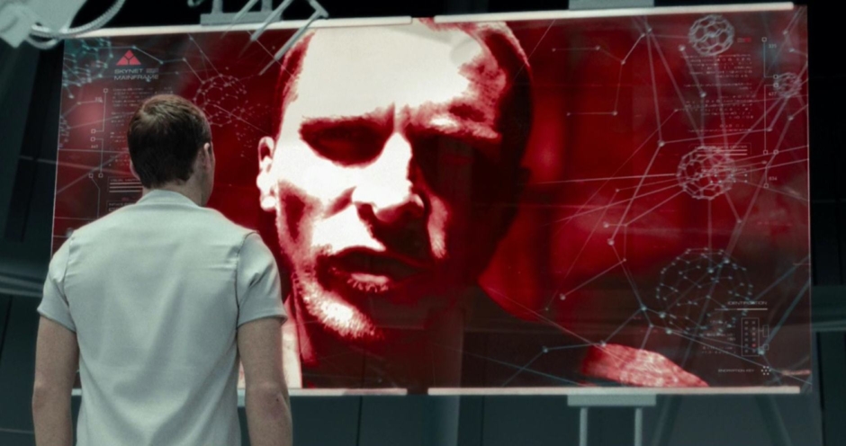 <p><strong>Figure 5.5</strong> During Marcus’ conversation with Skynet, the screen displays the Skynet mark in red in the top left corner, above type that identifies it as the SKYNET MAINFRAME. Source: <em>Terminator: Salvation</em></p>