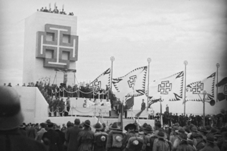 <p><strong>Figure 4.3</strong> The cross potent symbol on display, at a Fatherland Front rally in 1936. Source: <em>Wikipedia</em></p>