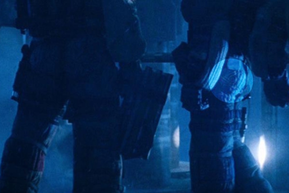 <p><strong>Figure 2.1</strong> It can be tough to see, but the Tricentennial patch (highlighted) is visible in the scene where Dallas, Lambert, and Kane use the ship’s elevator to descend to the surface of LV-426.</p>