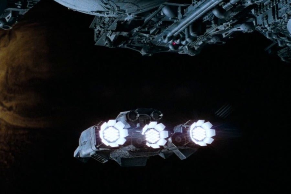 <p><strong>Figure 1.4</strong> Rear view of the USCSS Nostromo in flight, departing from the refinery it tows.</p>