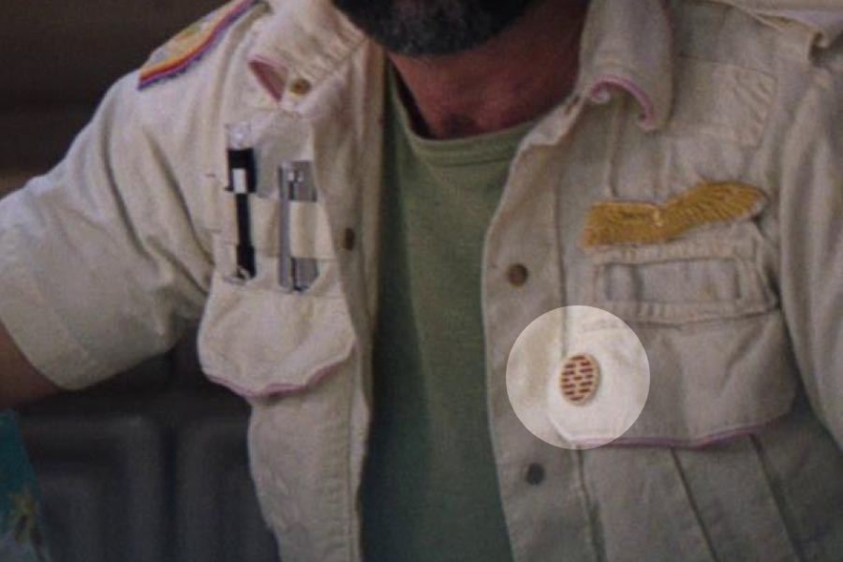 <p><strong>Figure 7.5</strong> Dallas wears his Executive Officer badge casually pinned to a front pocket flap, below the wings (highlighted).</p>