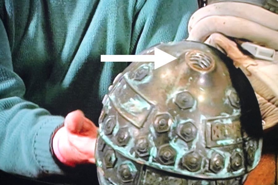 <p><strong>Figure 7.7</strong> In <em>The Alien Legacy</em> documentary, designer John Mollo points out the badge design as it appears on the shoulders of Company-issued pressure suits worn by the crew.</p>