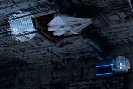 <p><strong>Figure 2.5</strong> In this shot, the blue Weylan-Yutani logo is visible in two places on the Nostromo, as well as the logotypes for the name and model of the lifeboat shuttle Narcissus (areas highlighted).</p>
