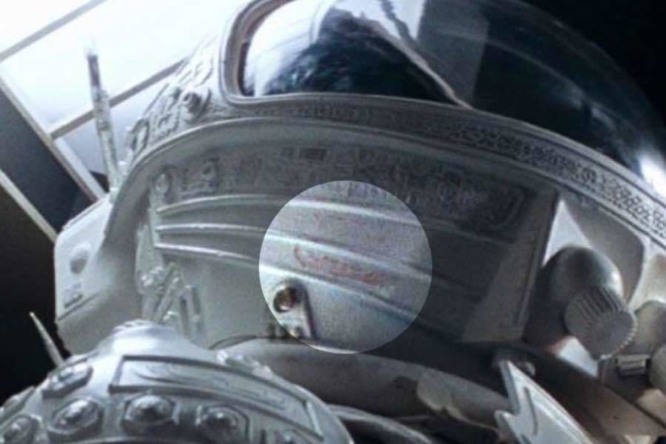 <p><strong>Figure 2.10</strong> As Ripley readies herself for a confrontation with the alien aboard the lifeboat shuttle, we see the logo stamped in red (highlighted) on the helmet of her space suit.</p>